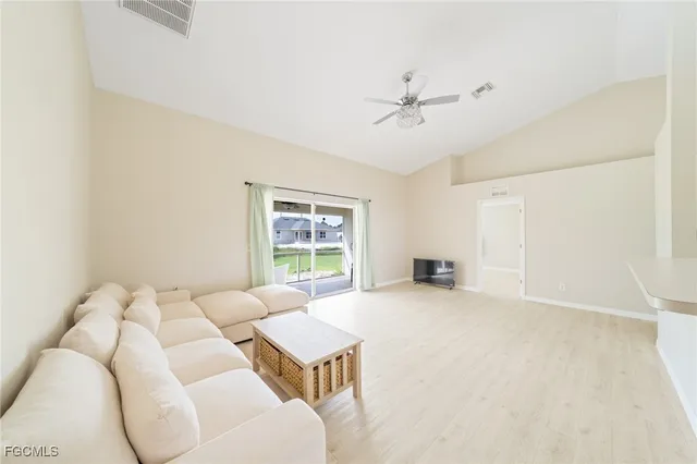 a view of a livingroom with furniture and windows