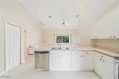 a kitchen with a sink and cabinets