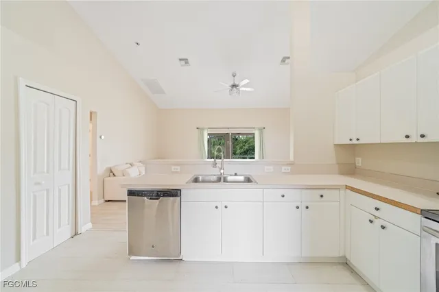 a kitchen with a sink and cabinets