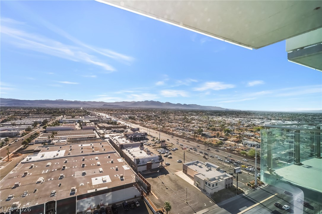 4381 West Flamingo Road, Unit 18305 Las Vegas, NV 89103 - Photo 19 of 19 Panoramic views extend across the urban landscape to distant mountains under a vast, open sky.