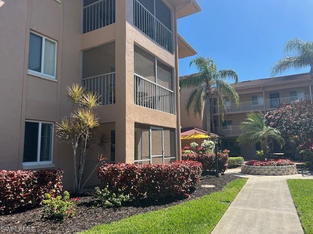 1075 Foxfire Lane, Unit 101 Naples, FL 34104 - Photo 1 of 12 View of building exterior