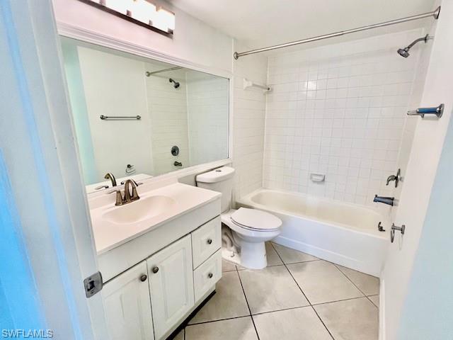 1075 Foxfire Lane, Unit 101 Naples, FL 34104 - Photo 11 of 12 Full bathroom with shower / washtub combination, vanity, toilet, and tile patterned floors
