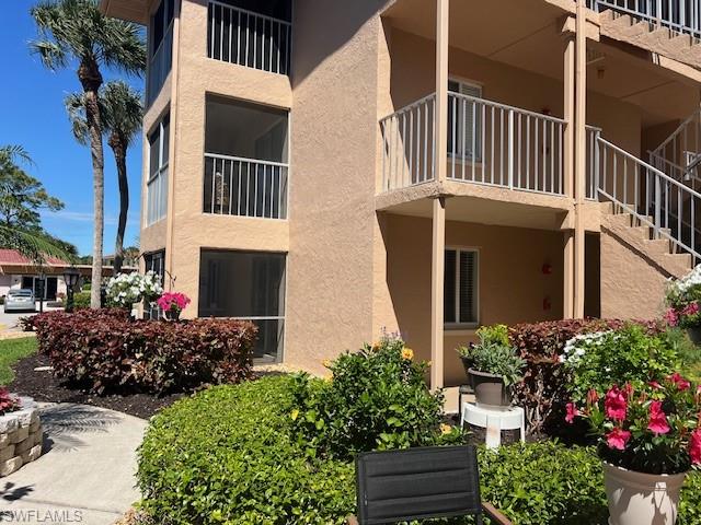 1075 Foxfire Lane, Unit 101 Naples, FL 34104 - Photo 2 of 12 View of building exterior