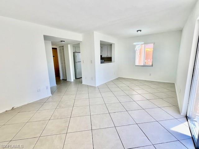 1075 Foxfire Lane, Unit 101 Naples, FL 34104 - Photo 6 of 12 light tile patterned floors