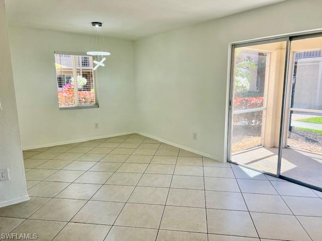 1075 Foxfire Lane, Unit 101 Naples, FL 34104 - Photo 8 of 12 light tile patterned floors