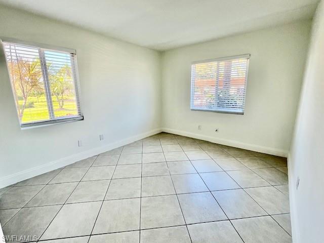 1075 Foxfire Lane, Unit 101 Naples, FL 34104 - Photo 9 of 12 light tile patterned floors