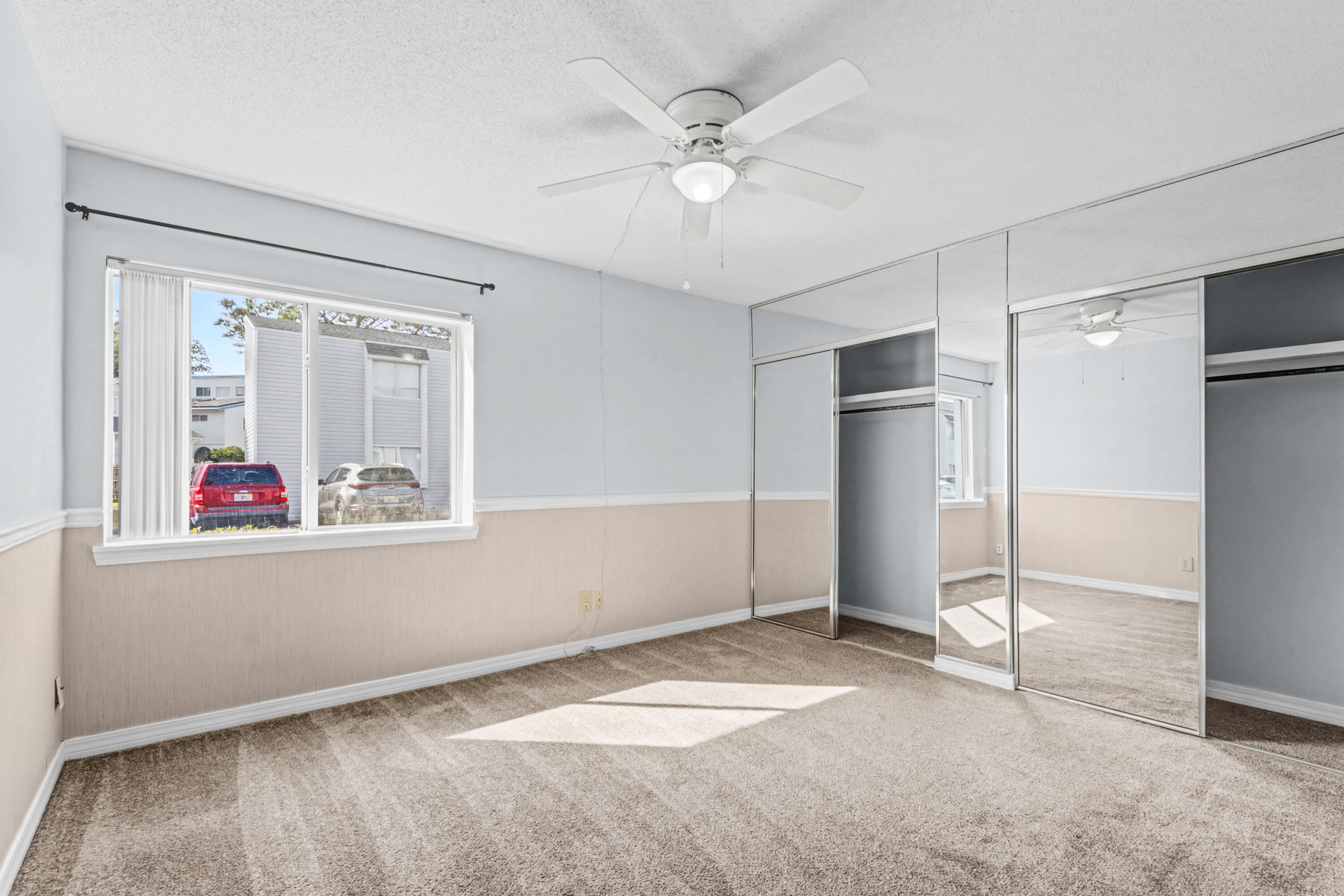 101 Old Ferry Road, Unit 10B Shalimar, FL 32579 - Photo 17 of 29 an empty room with windows and fan