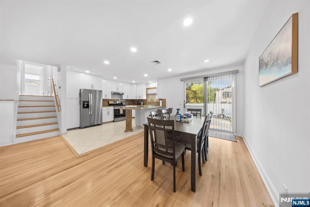 62 Sycamore Road Dumont, NJ 07628 - Photo 7 of 43 a dining room with furniture and wooden floor