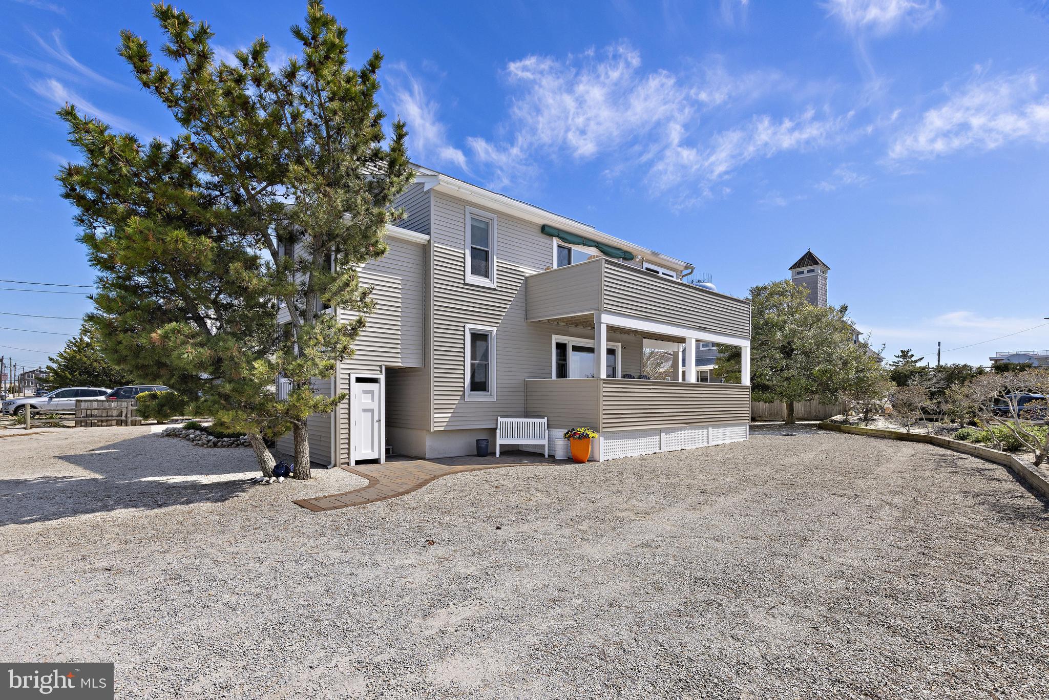 24 Joan Road Long Beach Township, NJ 08008 - Photo 29 of 55 a view of a house with a tree in front of it
