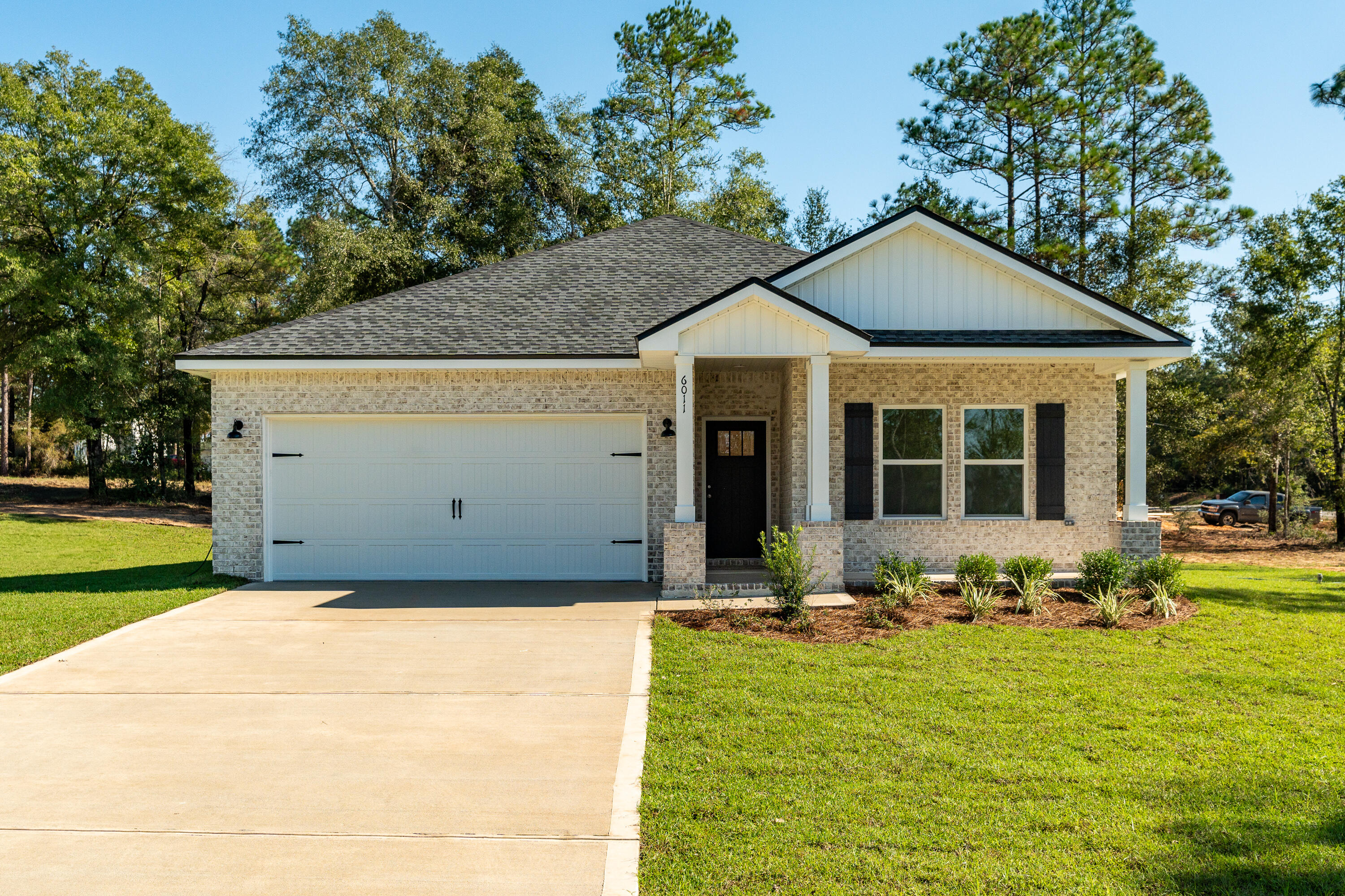 a front view of a house with yard