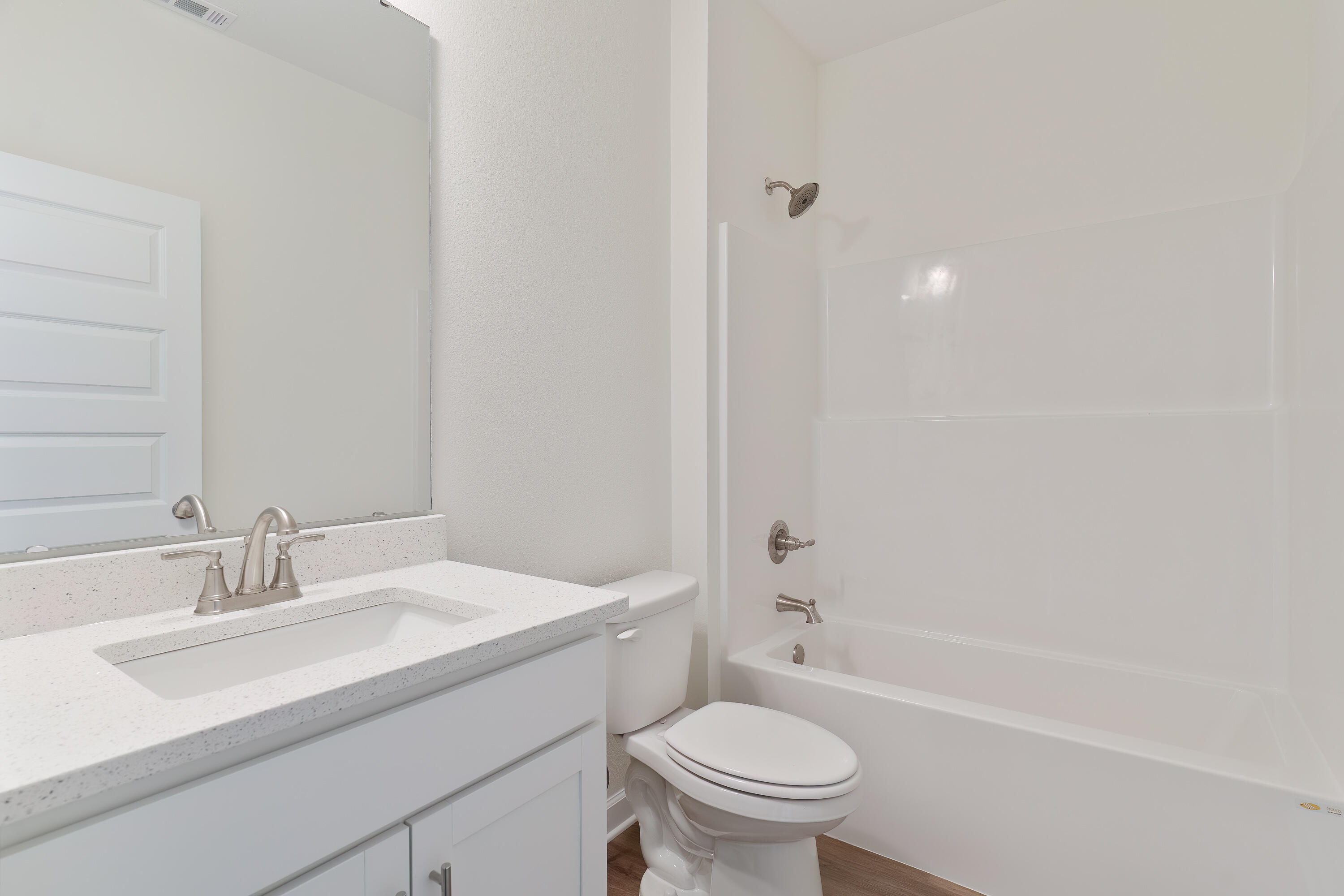 6430 Kylito Circle Crestview, FL 32539 - Photo 13 of 18 a bathroom with a sink toilet vanity and bathtub