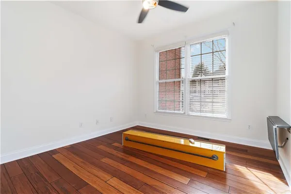 a view of wooden floor with a window
