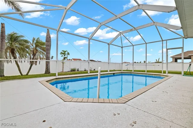 a view of swimming pool with outdoor seating