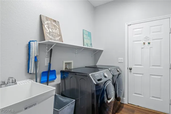 a utility room with dryer and washer