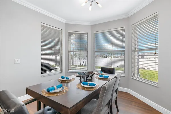 a view of a dining room with furniture and window