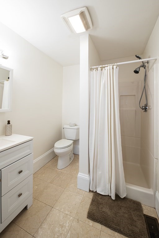 146 Lincoln Road, Unit A Lincoln, MA 01773 - Photo 6 of 11 a bathroom with a sink a toilet and shower