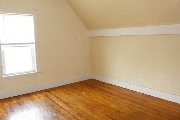 13 Florence Road Easthampton, MA 01027 - Photo 20 of 33 an empty room with wooden floor and windows