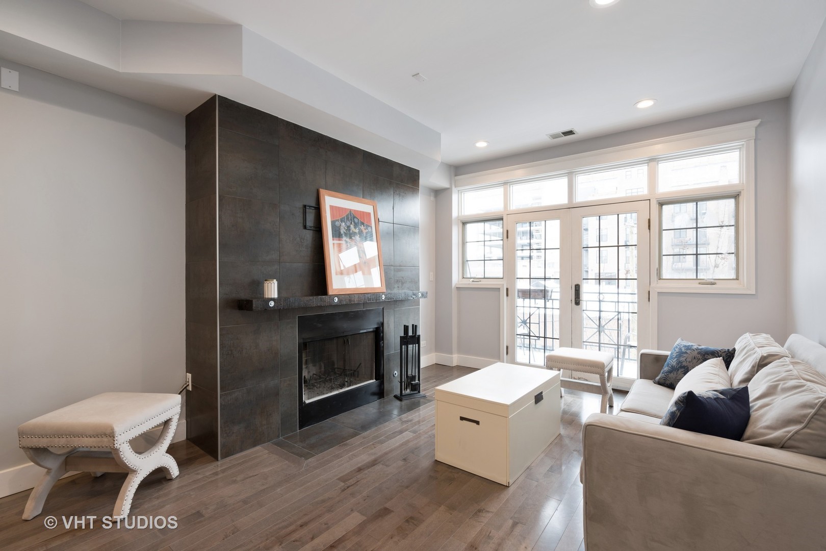 1048 West Fulton Market, Unit 3 Chicago, IL 60607 - Photo 2 of 16 a living room with furniture and a fireplace