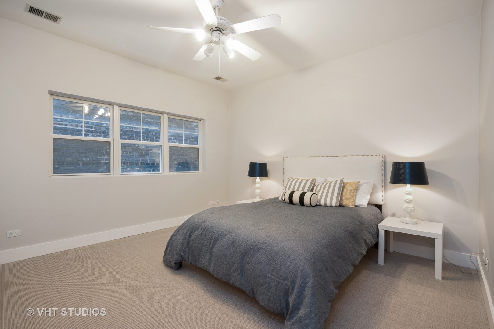 1048 West Fulton Market, Unit 3 Chicago, IL 60607 - Photo 12 of 16 a bedroom with a bed and a window