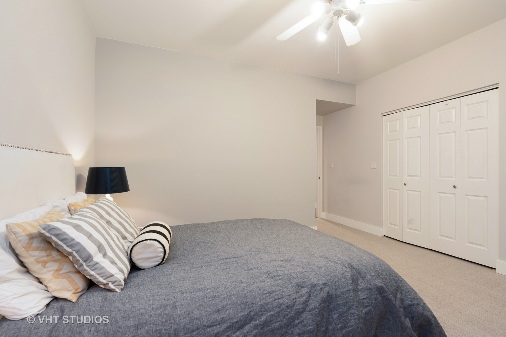 1048 West Fulton Market, Unit 3 Chicago, IL 60607 - Photo 13 of 16 a bedroom with a bed and a chandelier