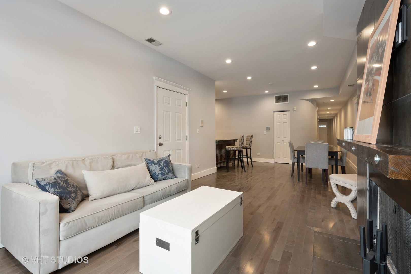 1048 West Fulton Market, Unit 3 Chicago, IL 60607 - Photo 4 of 16 a living room with furniture and a flat screen tv