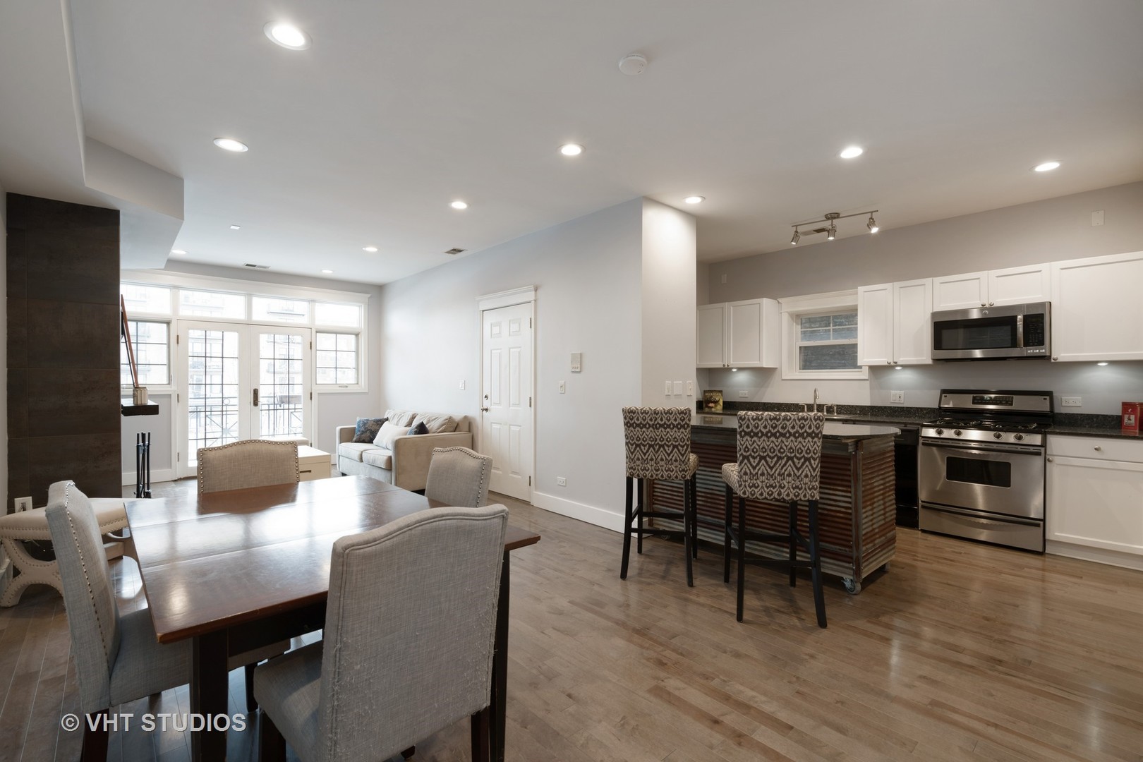 1048 West Fulton Market, Unit 3 Chicago, IL 60607 - Photo 6 of 16 a view of a dining room with furniture window and wooden floor
