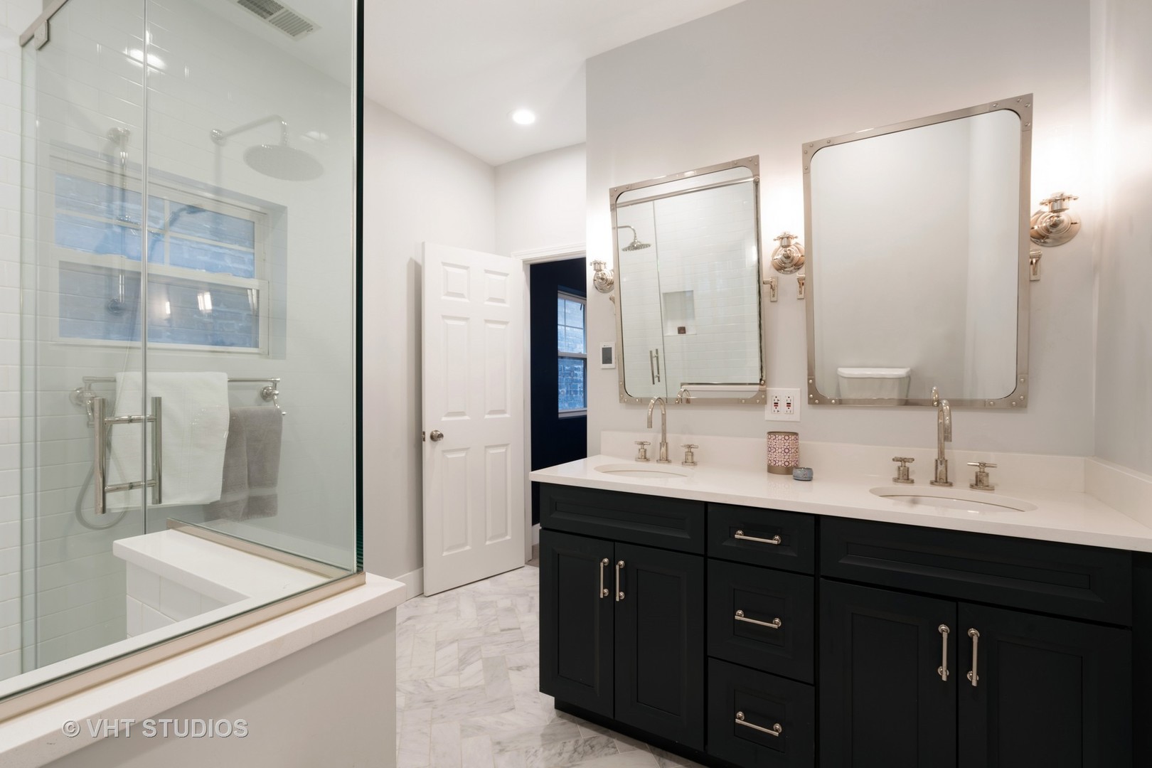 1048 West Fulton Market, Unit 3 Chicago, IL 60607 - Photo 10 of 16 a bathroom with a double vanity sink mirror and double