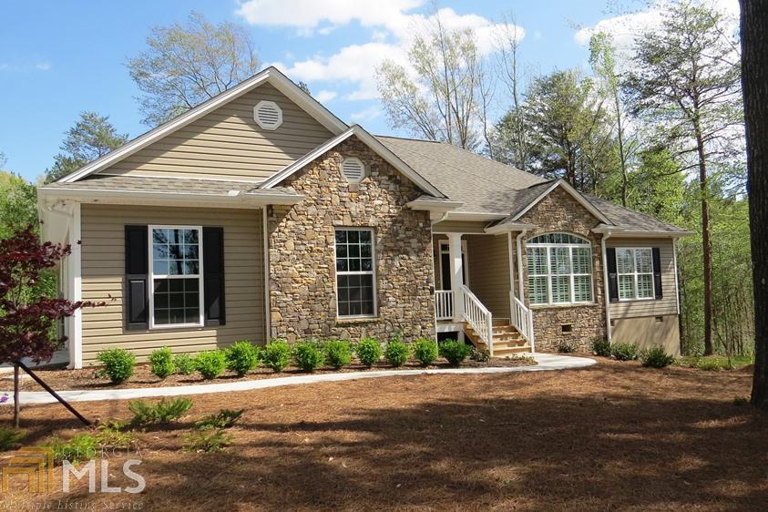 507 New Hope Road Toccoa, GA 30577 - Photo 1 of 1 a front view of a house with a yard and garage