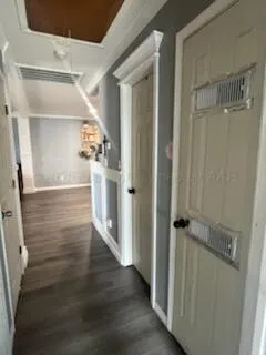 a view of hallway with wooden floor
