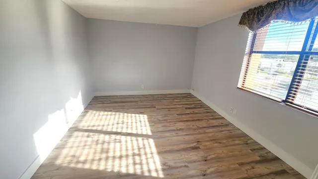 a view of an empty room and window