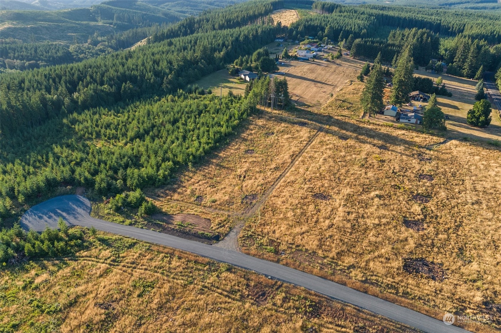 120 Brim Ridge Lane Winlock, WA 98596 - Photo 12 of 32 a view of a yard with wooden fence