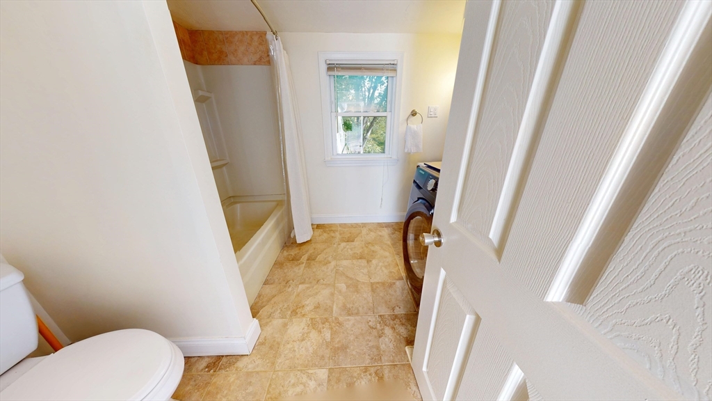 7 Penny Hill Road Melrose, MA 02176 - Photo 20 of 36 a bathroom with a granite countertop window and a sink