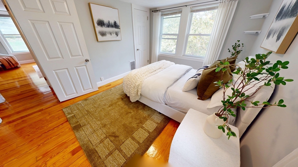 7 Penny Hill Road Melrose, MA 02176 - Photo 24 of 36 a bedroom with a bed table and a window