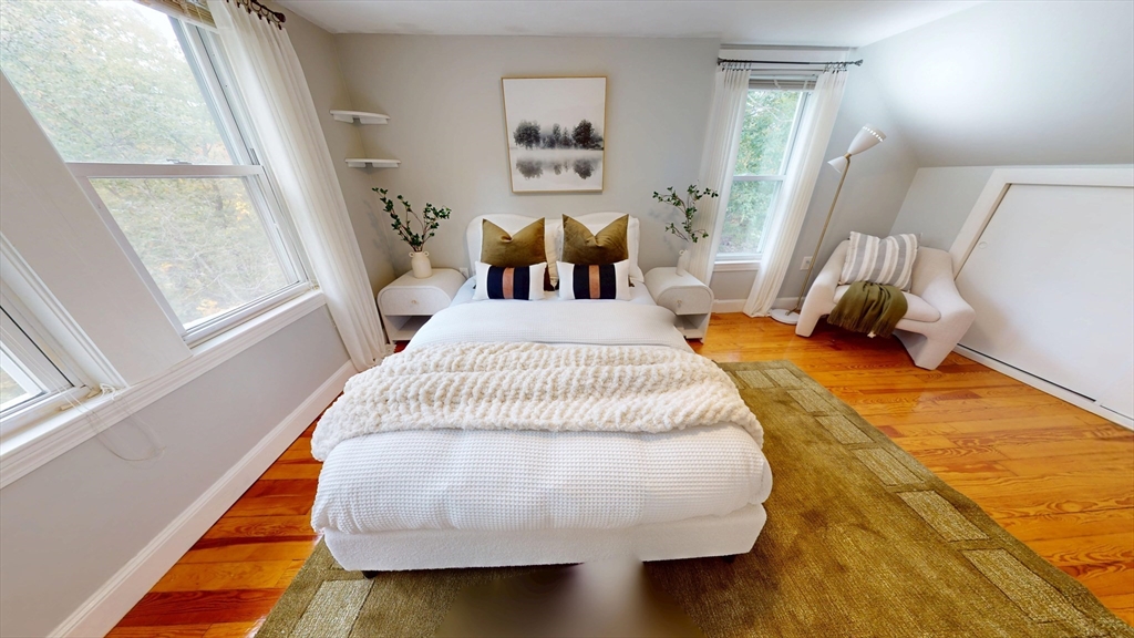 7 Penny Hill Road Melrose, MA 02176 - Photo 25 of 36 a bed sitting in a bedroom next to a window