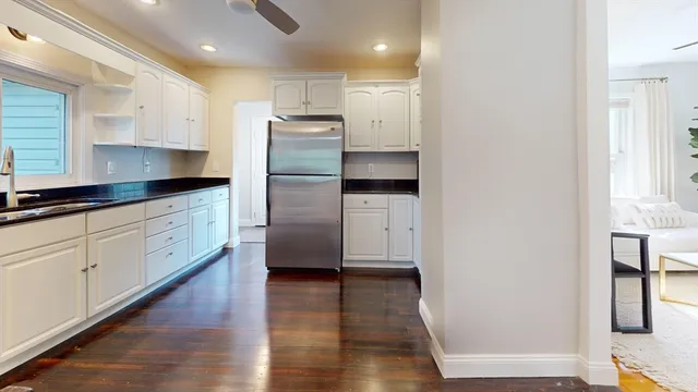 a kitchen with cabinets and stainless steel appliances