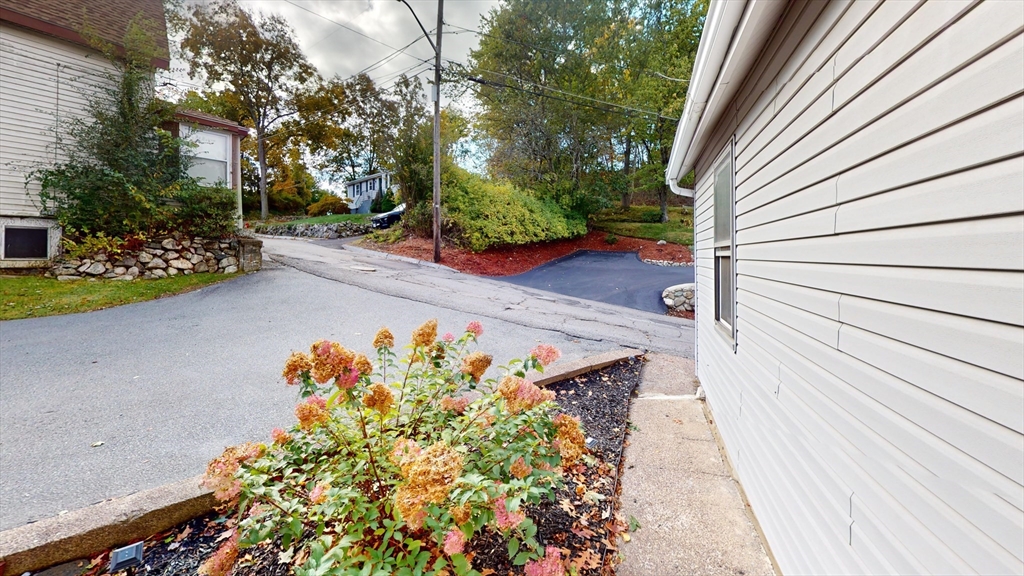 7 Penny Hill Road Melrose, MA 02176 - Photo 32 of 36 a view of a pathway with flower plants