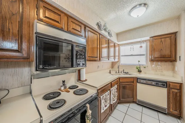 a kitchen with a stove and a sink