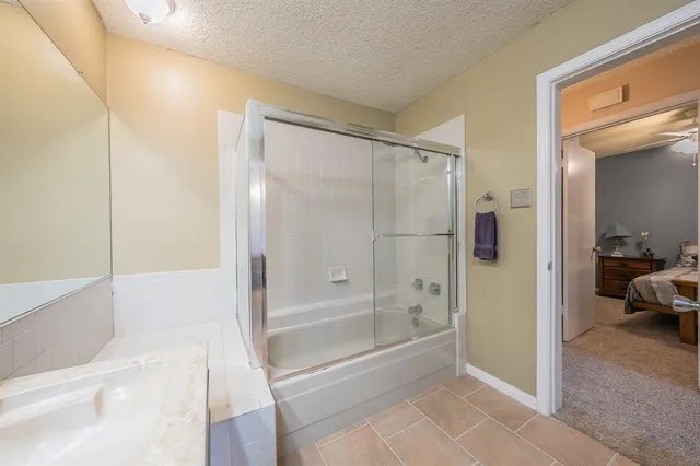 a bathroom with a bathtub and a shower