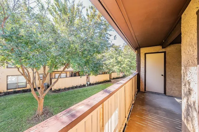 a view of balcony and yard