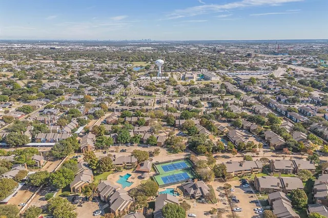 an aerial view of a city with lots of residential buildings