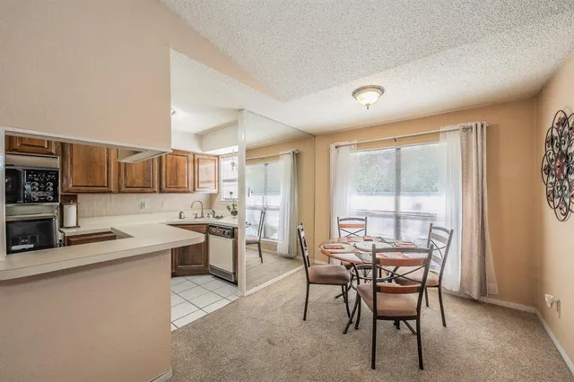 a view of a dining room kitchen and a window