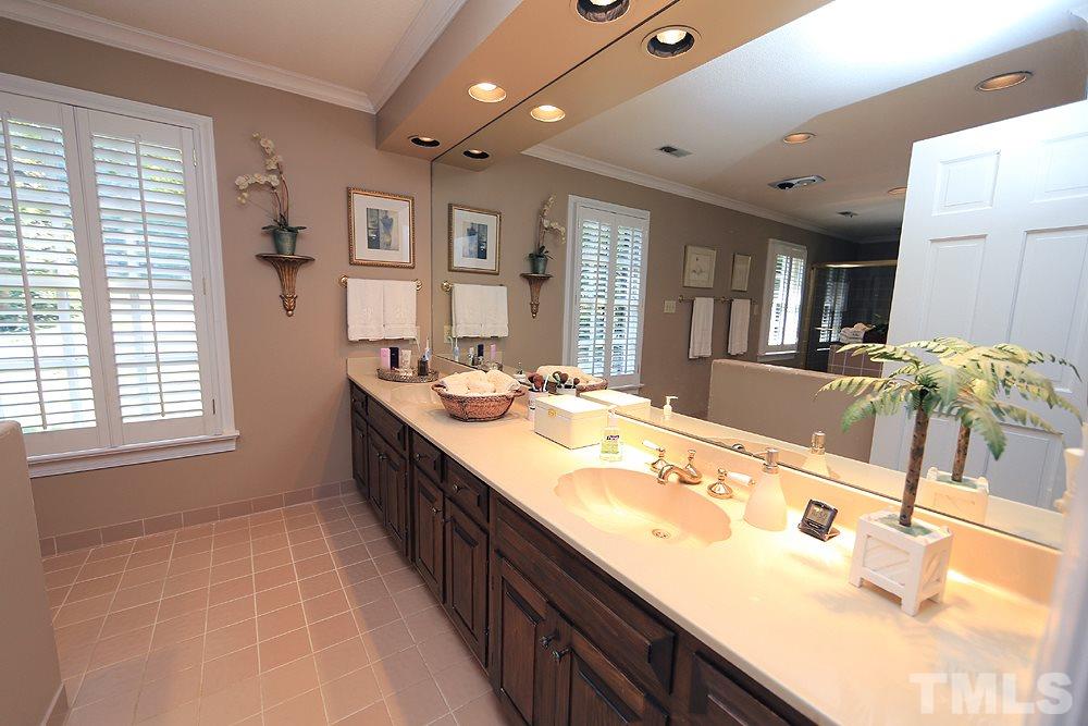 2308 Legacy Court Raleigh, NC 27615 - Photo 16 of 25 a spacious bathroom with a sink double vanity granite and a large mirror