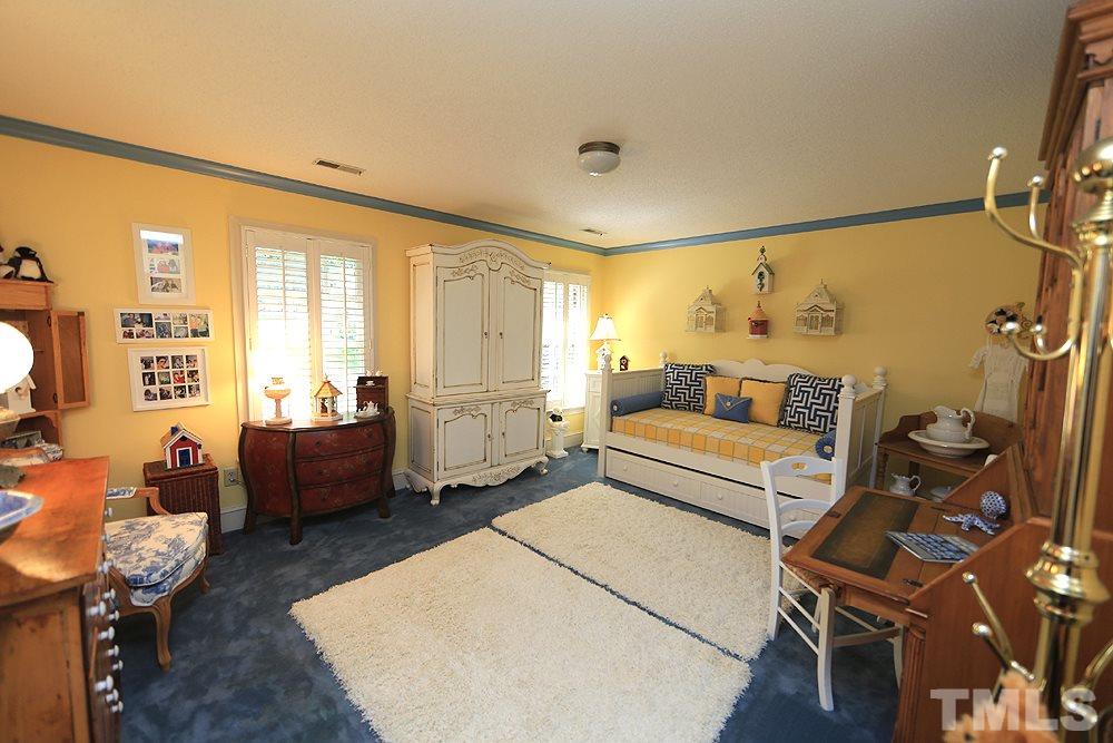 2308 Legacy Court Raleigh, NC 27615 - Photo 19 of 25 a bed room with a bed and a couch