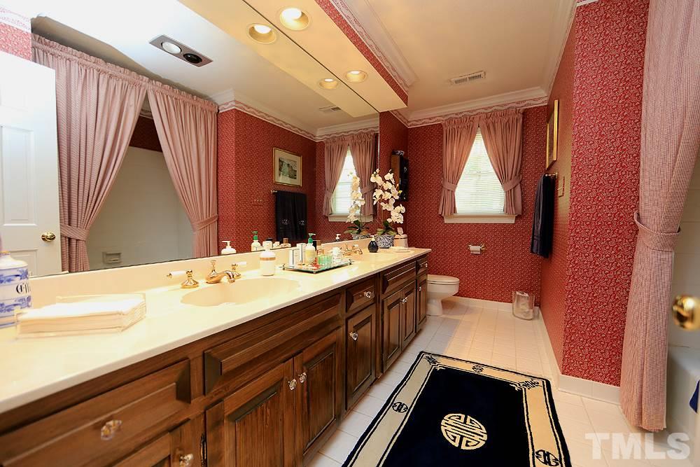 2308 Legacy Court Raleigh, NC 27615 - Photo 20 of 25 a spacious bathroom with a sink and a large mirror