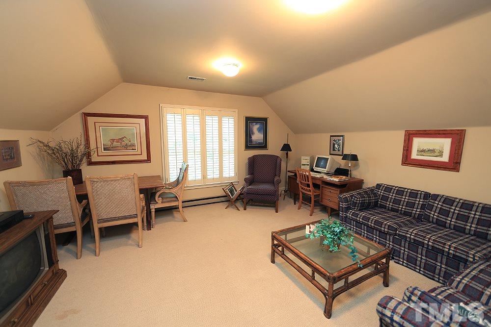 2308 Legacy Court Raleigh, NC 27615 - Photo 25 of 25 a living room with furniture a rug and a window