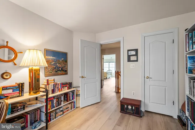 a room with furniture a rug and a book shelf