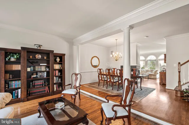 a living room with furniture a view and a book shelf