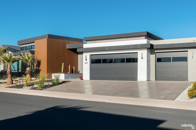 3607 South Cypress Pt Road Hurricane, UT 84737 - Photo 3 of 59 Modern home featuring an attached garage and concrete driveway