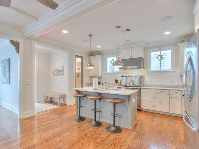 a kitchen with a sink cabinets and window