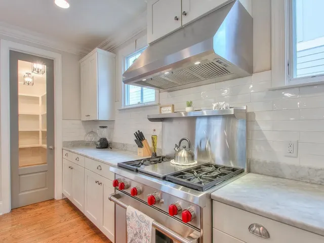 a kitchen with a stove and a sink